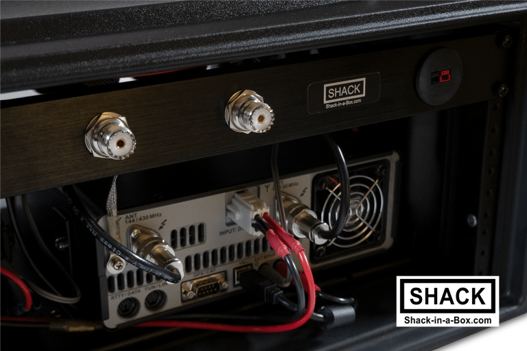 Close-up of the Yaesu All-in-One rear panel with antenna connectors above the radio