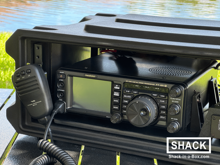 Close-up of the Yaesu FT-991A mounted in the HVU1-991A Go Box with the microphone clip