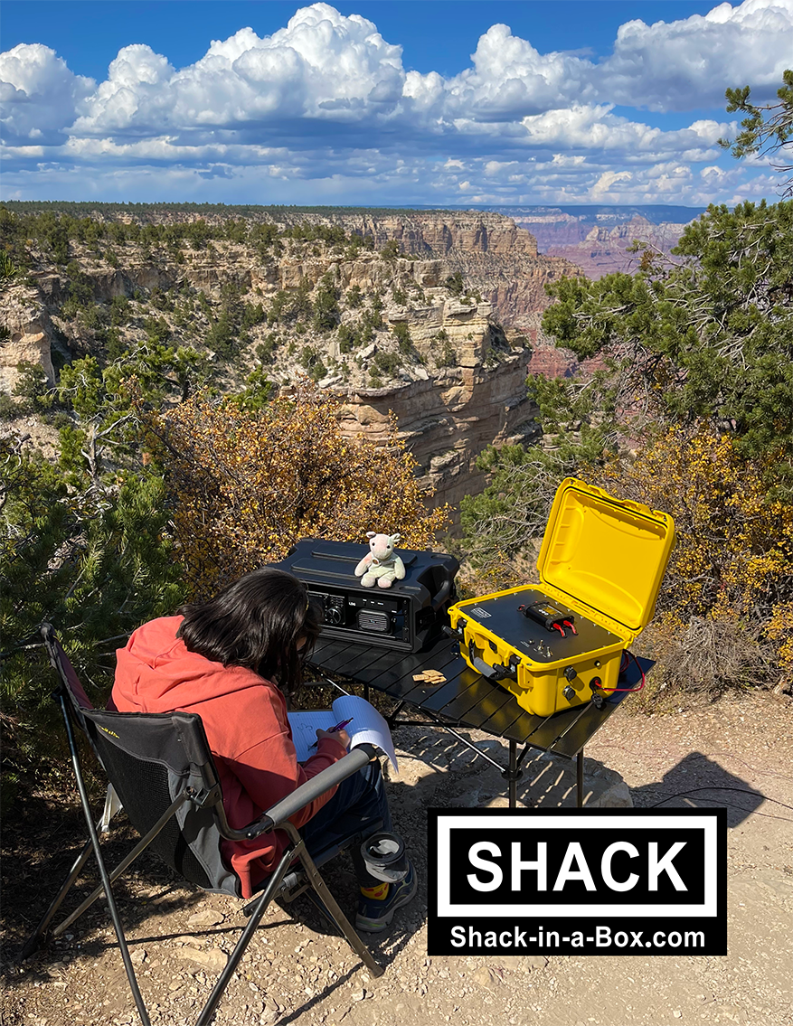 Amateur radio operator using Shack-in-a-Box HF1-7300 and Solaris 720Wh at Grand Canyon overlook.