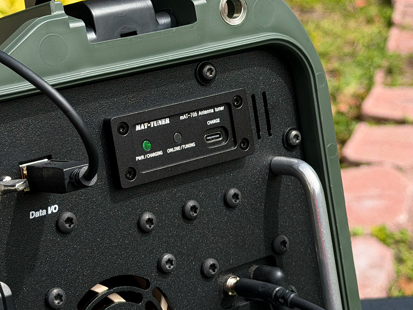 Close-up of the IC-705 Grab-and-Go Box showing the custom-mounted mAT-705 autotuner with visible indicator lights and USB-C charging port.